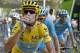 Team Astana with Italy's Vincenzo Nibali, wearing the overall leader's yellow jersey, celebrates with a glass of champagne during the twenty-first and last stage of the Tour de France cycling race over 137.5 kilometers (85.4 miles) with start in Evry and finish in Paris, France, Sunday, July 27, 2014. (AP Photo/Jean-Paul Pelissier, Pool)