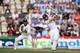 SOUTHAMPTON, ENGLAND - JULY 28: England batsman Jos Buttler hits Jadeja for six runs watched by India wicketkeeper M.S. Dhoni during day two of the 3rd Investec Test at Ageas Bowl on July 28, 2014 in Southampton, England. (Photo by Stu Forster/Getty Images)