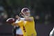 Southern California quarterback Max Browne (4) throws a pass during spring practice for the NCAA college football team in Los Angeles on Thursday, March 13, 2014. (AP Photo/Damian Dovarganes)