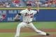 Atlanta Braves works pitcher Alex Wood (40) works in the first inning of a baseball game against the Philadelphia Phillies in Atlanta, Sunday, July 20, 2014.(AP Photo/John Bazemore)