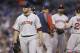 Boston Red Sox starting pitcher Jon Lester heads to the dugout after being removed during the fifth inning of a baseball game against the Detroit Tigers in Detroit, Saturday, June 7, 2014. (AP Photo/Carlos Osorio)