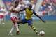 HARRISON, NJ - JULY 26: About Diaby #24 of Arsenal fights for the ball with Tim Cahill #17 of New York Red Bulls during their friendly match at Red Bull Arena on July 26, 2014 in Harrison, NJ. (Photo by Jeff Zelevansky/Getty Images)