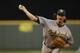 Oakland Athletics starting pitcher Jeff Samardzija throws against the Seattle Mariners during a baseball game, Friday, July 11, 2014, in Seattle. (AP Photo/Ted S. Warren)
