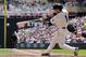 Minnesota Twins' Sam Fuld drives in a run with a single off Cleveland Indians pitcher Trevor Bauer in the third inning of a baseball game, Wednesday, July 23, 2014, in Minneapolis. (AP Photo/Jim Mone)