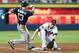 Jul 25, 2014; Atlanta, GA, USA; San Diego Padres center fielder Chris Denorfia (13) runs back to third base while Atlanta Braves third baseman Chris Johnson (23) stops the throw from the outfield during the first inning at Turner Field. Mandatory Credit: Dale Zanine-USA TODAY Sports