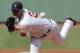 Boston Red Sox starting pitcher Jon Lester (31) delivers during the first inning of a baseball game at Fenway Park in Boston, Thursday, July 10, 2014. (AP Photo/Charles Krupa)