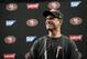 San Francisco 49ers head coach Jim Harbaugh smiles as he answers questions from the media during an NFL football training camp on Thursday, July 24, 2014, in Santa Clara, Calif. (AP Photo)