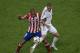 Real's Karim Benzema, right, and Atletico's Miranda during the Champions League final soccer match between Atletico Madrid and Real Madrid in Lisbon, Portugal, Saturday, May 24, 2014. (AP Photo/Paulo Duarte)