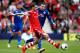 SOUTHAMPTON, ENGLAND - APRIL 12: Morgan Schneiderlin of Southampton passes under pressure from Jordan Mutch of Cardiff during the Barclays Premier League match between Southampton and Cardiff City at St Mary's Stadium on April 12, 2014 in Southampton, England. (Photo by Ben Hoskins/Getty Images)