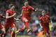 10ThingstoSeeSports - Liverpool's Philippe Coutinho, center, celebrates with teammate Steven Gerrard, left, after he scored the third goal of the game for his side during their English Premier League soccer match against Manchester City at Anfield in Liverpool, England, Sunday, April 13, 2014. (AP Photo/Clint Hughes, File)