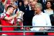 LONDON, ENGLAND - MAY 17: Captain Thomas Vermaelen of Arsenal passes the trophy to Arsene Wenger manager of Arsenal (R) after the FA Cup with Budweiser Final match between Arsenal and Hull City at Wembley Stadium on May 17, 2014 in London, England. (Photo by Clive Mason/Getty Images)