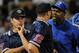 Jose Offerman, right, manager of the Dominican Republic winter league team Licey Tigers, argues with plate umpire Jason Bradley, as first base umpire Daniel Rayburn, left, looks on, during a playoff series game against Cibao Giants in Santo Domingo, Saturday, Jan. 16, 2010. Offerman, a former major league All-Star, threw a punch at Rayburn during the argument, the second time in two and a half years that he's attacked someone on a baseball field. (AP Photo/Victor Calvo)