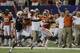 Clemson running back Andre Ellington (23) puts a stiff arm on Auburn defensive back Jermaine Whitehead (9) as he runs for a first down in the second half of a NCAA college football game at the Georgia Dome in Atlanta Saturday, Sept. 1, 2012. Clemson beat Auburn 26-19. (AP Photo/Dave Martin)