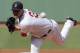 Boston Red Sox starting pitcher Jon Lester (31) delivers during the first inning of a baseball game at Fenway Park in Boston, Thursday, July 10, 2014. (AP Photo/Charles Krupa)
