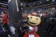 Ohio State's mascot, Brutus Buckeye, grabs a television camera before the start of a West Regional final against Wichita State in the NCAA college basketball tournament, Saturday, March 30, 2013, in Los Angeles. (AP Photo/Mark J. Terrill)