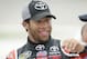Darrell Wallace Jr. reacts with crew members after winning the pole position during qualifying for the NASCAR Trucks Series auto race, Friday, July 11, 2014, at Iowa Speedway in Newton, Iowa. (AP Photo/Charlie Neibergall)