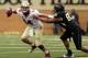 Florida State quarterback Jacob Coker tries to avoid Wake Forest defensive end James Looney in the second half of an NCAA college football game in Winston-Salem, N.C., Saturday, Nov. 9, 2013. Florida State won 59-3. (AP Photo/Nell Redmond)