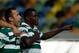 Sporting's William Carvalho, right, celebrates after scoring the opening goal against Pacos de Ferreira during their Portuguese league soccer match Sunday, Dec. 1, 2013, at Sporting's Alvalade stadium in Lisbon. (AP Photo/Armando Franca)
