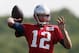 New England Patriots quarterback Tom Brady passes during NFL football training camp in Foxborough, Mass., Saturday, July 26, 2014. (AP Photo)
