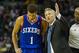 Apr 12, 2014; Charlotte, NC, USA; Philadelphia 76ers head coach Brett Brown talks with guard Michael Carter-Williams (1) during the second half against the Charlotte Bobcats at Time Warner Cable Arena. The Bobcats defeated the 76ers 111-105. Mandatory Credit: Jeremy Brevard-USA TODAY Sports