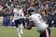 Chicago Bears quarterback Jay Cutler (6) throws a 5-yard touchdown pass to wide receiver Brandon Marshall in the second quarter of an NFL football game against the Cleveland Browns Sunday, Dec. 15, 2013, in Cleveland. (AP Photo/Tony Dejak)