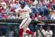 Philadelphia Phillies' Marlon Byrd fouls the ball off his foot during the first inning of a baseball game against the San Francisco Giants, Thursday, July 24, 2014, in Philadelphia. (AP Photo/Chris Szagola)