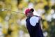 Sep 28, 2012; Medinah, IL, USA; United States golfer Tiger Woods hits a shot on the 17th hole during the 39th Ryder Cup on day one at Medinah Country Club. Mandatory Credit: Brian Spurlock-USA TODAY Sports
