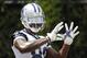 Jun 17, 2014; Dallas, TX, USA; Dallas Cowboys receiver Dez Bryant (88) catches footballs for a drill during minicamp at Cowboys headquarters at Valley Ranch. Mandatory Credit: Matthew Emmons-USA TODAY Sports