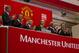 Executives from Manchester United, including Avram Glazer, fourth from left, and Joel Glazer, third from left, applaud after ringing the opening bell at the New York Stock Exchange on Friday, Aug. 10, 2012 in New York. Shares of soccer club Manchester United made their public debut Friday, edging up slightly as shareholders' enthusiasm for the celebrated team was offset by worry about its debt load and financial performance. (AP Photo/Jin Lee)