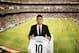 New Real Madrid player James Rodriguez, from Colombia, holds his new shirt and poses for photographers during his official presentation at the Santiago Bernabeu stadium in Madrid, Spain, Tuesday, July 22, 2014, after signing for Real Madrid. Real Madrid have signed Rodriguez from Monaco on a six-year contract. (AP Photo/Daniel Ochoa de Olza)