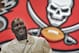 Former Tampa Bay Buccaneers linebacker Derrick Brooks smiles as he answers a question during a news conference Tuesday, May 6, 2014, in Tampa, Fla., after it was announced that he would be inducted into the team's Ring of Honor. Brooks played 14 season with the Buccaneers. (AP Photo/Chris O'Meara)