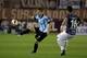 Racing Club's Luciano Vietto, left, vies for the ball with Victor Ayala of Lanus at a Copa Sudamericana soccer match in Buenos Aires, Argentina, Wednesday, Aug. 28, 2013. (AP Photo/Eduardo Di Baia)