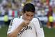 New Real Madrid player James Rodriguez, from Colombia, kisses Real's emblem of his shirt during his official presentation at the Santiago Bernabeu stadium in Madrid, Spain, Tuesday, July 22, 2014, after signing for Real Madrid. Real Madrid have signed Rodriguez from Monaco on a six-year contract, (AP Photo/Daniel Ochoa de Olza)