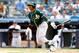 NEW YORK, NY - JUNE 05: Yoenis Cespedes #52 of the Oakland Athletics follows through on a fourth inning base hit against the New York Yankees at Yankee Stadium on June 5, 2014 in the Bronx borough of New York City. (Photo by Jim McIsaac/Getty Images)