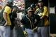 Oakland Athletics' Yoenis Cespedes, center, is congratulated in the dugout after his solo home run off of Texas Rangers starting pitcher Nick Tepesch in the sixth inning of a baseball game, Saturday, July 26, 2014, in Arlington, Texas. (AP Photo/Tony Gutierrez)