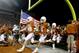 FILE- In this Nov. 22, 2012, file photo, Texas players Kenny Vaccaro (4) and Cedric Reed (88) enter the stadium before the start of an NCAA college football game against TCU in Austin, Texas. Texas has the most valuable college football program in the nation, according to Forbes Magazine. Forbes released its college football evaluations Wednesday, Dec. 19, 2012. The magazine says the Longhorns are worth $133 million, up from $129 million last year. (AP Photo/Jack Plunkett, File)