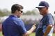 Mar 5, 2014; Port Charlotte, FL, USA; Tampa Bay Rays manager Joe Maddon (70) and VP of baseball operations Andrew Friedman talk prior to the game against the New York Yankees at Charlotte Sports Park. Mandatory Credit: Kim Klement-USA TODAY Sports