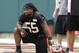 Cincinnati Bengals outside linebacker Vontaze Burfict takes a break during an NFL football mandatory minicamp, Wednesday, June 11, 2014, in Cincinnati. (AP Photo/Al Behrman)