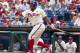Philadelphia Phillies' Marlon Byrd fouls the ball off his foot during the first inning of a baseball game against the San Francisco Giants, Thursday, July 24, 2014, in Philadelphia. (AP Photo/Chris Szagola)