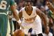 Phoenix Suns guard Eric Bledsoe plays defense against the Boston Celtics during the second half of the Suns 87-80 win in an NBA basketball game in Boston Friday, March 14, 2014. (AP Photo/Winslow Townson)