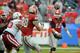 Georgia quarterback Hutson Mason (14) throws a pass to tight end Arthur Lynch (88) during the first half of the Gator Bowl NCAA college football game against Nebraska, Wednesday, Jan. 1, 2014, in Jacksonville, Fla. (AP Photo/Stephen B. Morton)