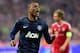 Manchester United's Patrice Evra, left, celebrates his side's opening goal during the Champions League quarterfinal second leg soccer match between Bayern Munich and Manchester United in the Allianz Arena in Munich, Germany, Wednesday, April 9, 2014. At right is Bayern's Philipp Lahm. (AP Photo/Kerstin Joensson)