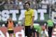 Dortmund's Mats Hummels leaves the pitch disappointed after he saw the red card during the German first division Bundesliga soccer match between Borussia Moenchengladbach and Borussia Dortmund in Moenchengladbach, Germany, Saturday, Oct. 5, 2013. Moenchengladbach defeated Dortmund with 2-0. (AP Photo/Martin Meissner)