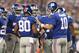 Sep 8, 2013; Arlington, TX, USA; New York Giants quarterback Eli Manning talks with receiver Victor Cruz (80) runs after a catch against the Dallas Cowboys at AT&T Stadium. Mandatory Credit: Matthew Emmons-USA TODAY Sports