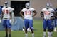 New York Giants' Larry Donnell, left, Xavier Grimble, center, and Daniel Fells during a NFL football camp in East Rutherford, N.J., Wednesday, July 23, 2014. (AP Photo/Seth Wenig)
