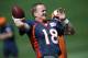 Denver Broncos quarterback Peyton Manning warms up during the morning session at the team's NFL training camp at Broncos headquarters in Englewood, Colo., on Friday, Aug. 1, 2014. (AP Photo/David Zalubowski)