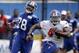 New York Giants' Andre Williams, right, runs past Jayron Hosley during a NFL football camp in East Rutherford, N.J., Thursday, July 24, 2014. (AP Photo/Seth Wenig)