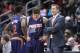 Phoenix Suns head coach Jeff Hornacek, right, talks with Phoenix Suns guard Eric Bledsoe (2) and Phoenix Suns guard Goran Dragic (1) during a break from an NBA basketball game against the Atlanta Hawks Monday, March 24, 2014, in Atlanta. Phoenix defeated Atlanta 102-95. (AP Photo/Jason Getz)
