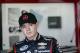 Driver Kyle Larson waits in his garage during practice for the Brickyard 400 Sprint Cup series auto race at the Indianapolis Motor Speedway in Indianapolis, Friday, July 25, 2014. (AP Photo/AJ Mast)