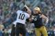 Nov. 17, 2012; South Bend, IN, USA; Wake Forest Demon Deacons quarterback Tanner Price (10) throws under pressure from Notre Dame Fighting Irish defensive end Tony Springmann (69) in the first quarter at Notre Dame Stadium. Notre Dame won 38-0. Mandatory Credit: Matt Cashore-USA TODAY Sports